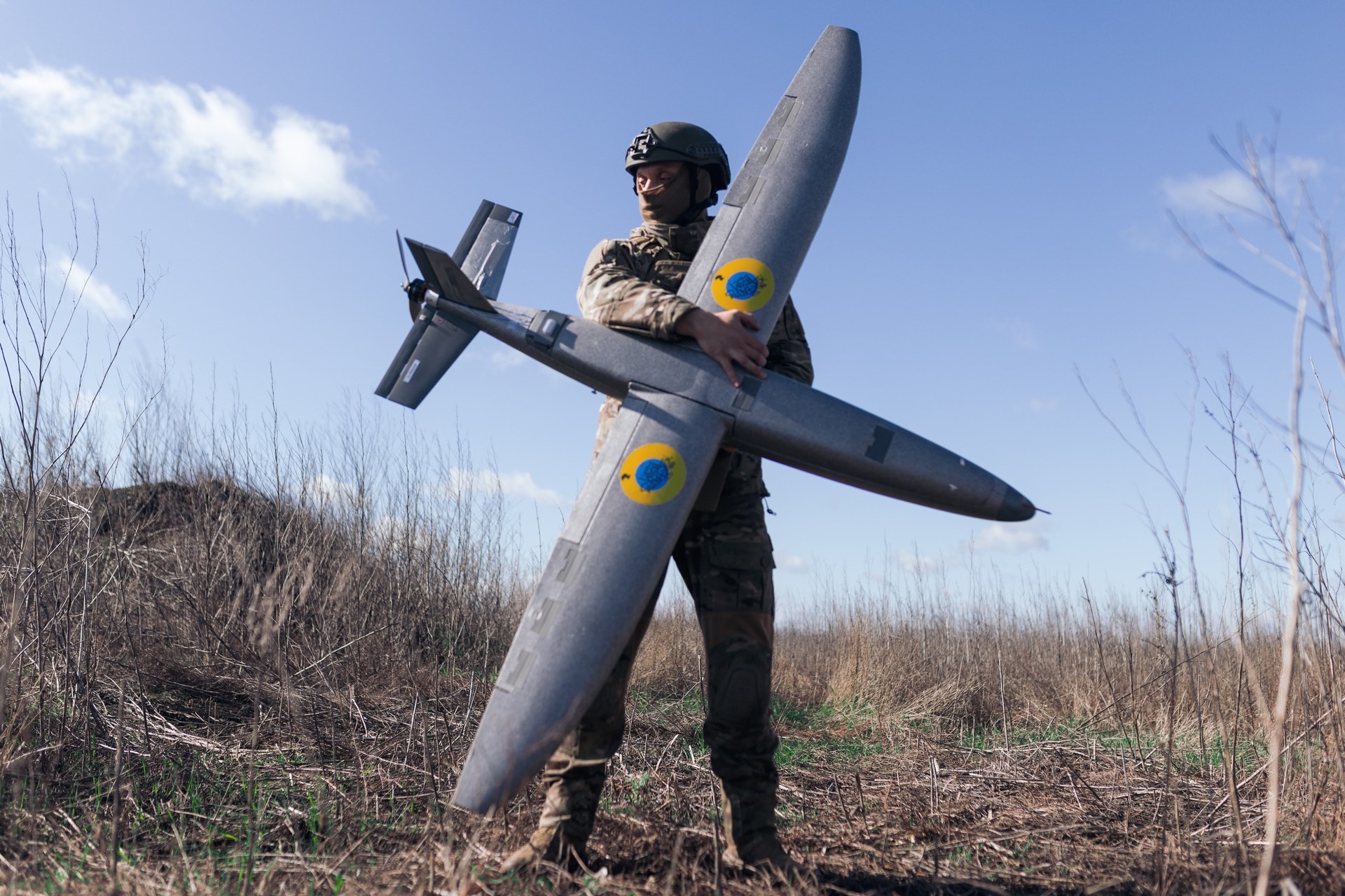 A Ukrainian soldier launches a reconnaissance drone